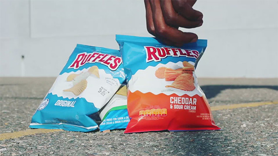 Chris Smith a.k.a. CLS, picking up a pack of Ruffles during a video shoot for the Ruffles Ridge NBA All-Star Social Media partnership.