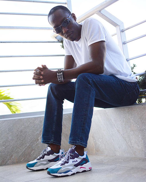 Chris Smith a.k.a. CLS, out on the mall in casual wear, wearing the new Fila Ray Tracer sneakers during a promotional campaign for the shoes.