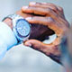 Chris Smith a.k.a. CLS, checking his Fossil watch in an Instagram post.